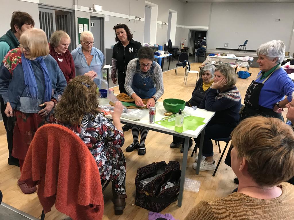 Guild members watching former International Feltmakers Association president Mandy Nash teach us how to create wet felted bags.